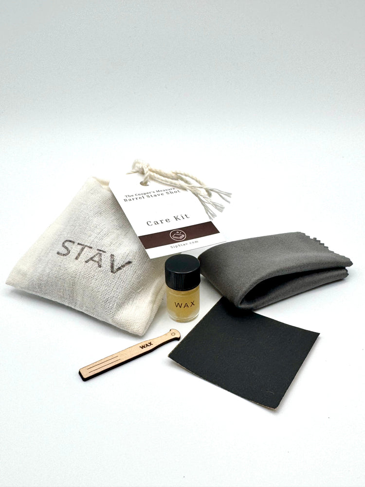 STĀV wood care kit with conditioning wax, applicator, polishing cloth, sanding pad, and cotton storage pouch